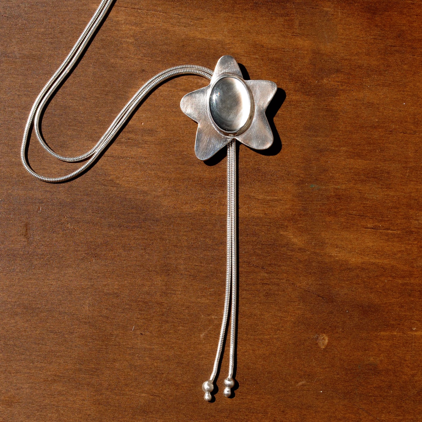 Black Mother of Pearl Star Bolo Tie