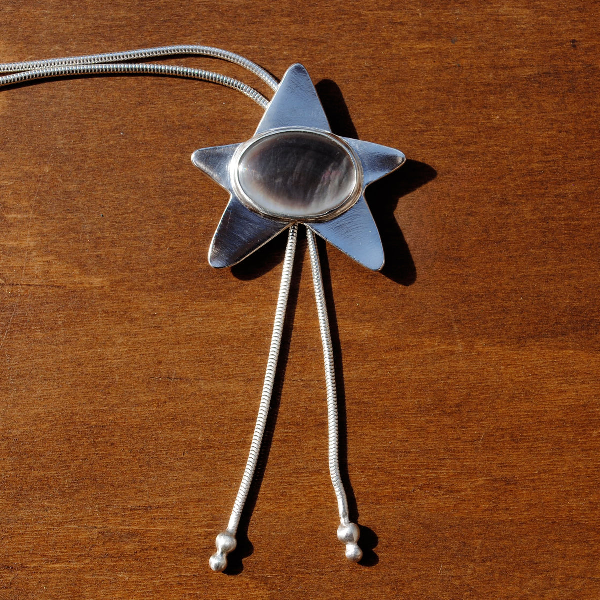 Black Mother of Pearl Star Bolo Tie