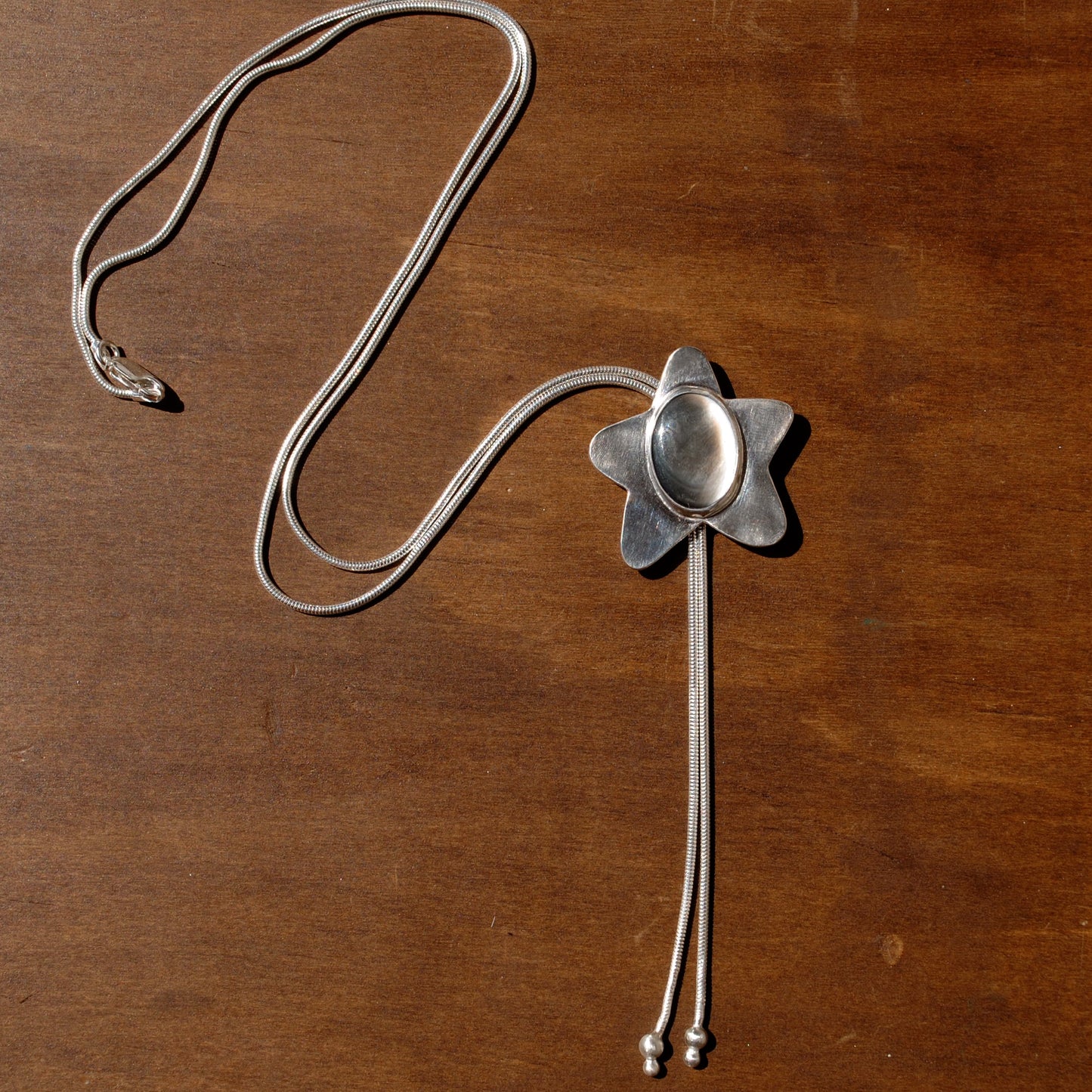Black Mother of Pearl Star Bolo Tie